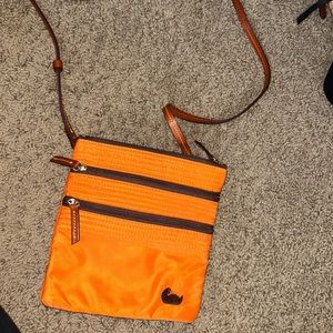 A orange shoulder bag.